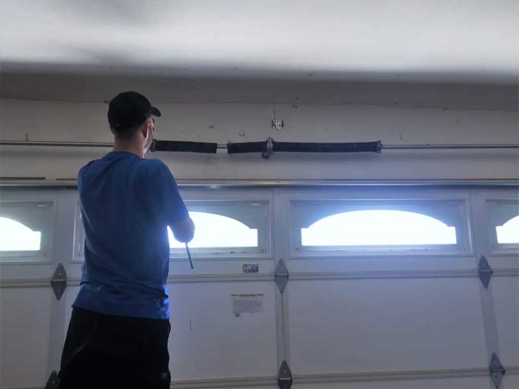 AER technician repairing a garage door in Valley Village