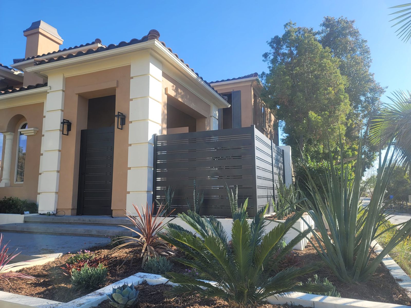 Modern black horizontal privacy fence and gate installed by AER